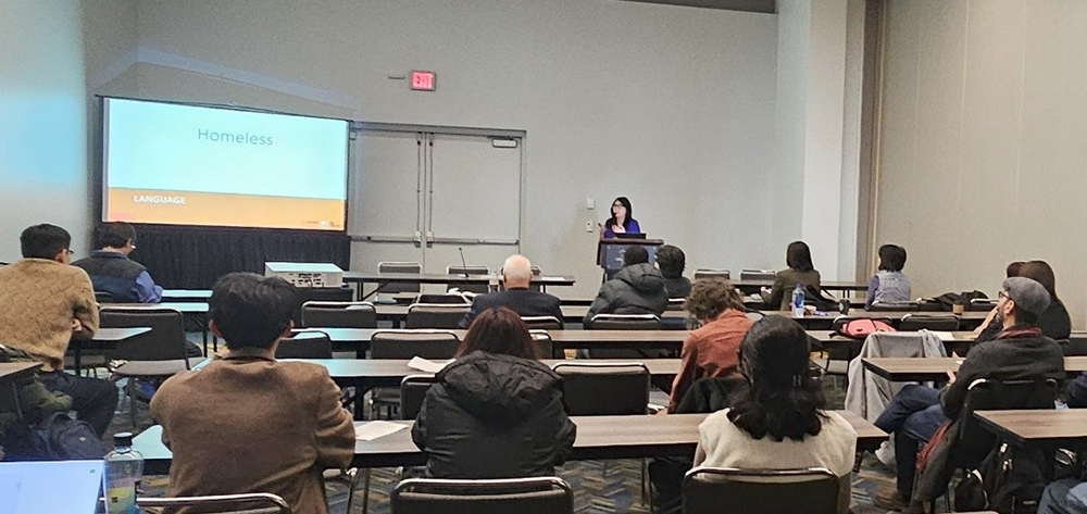 woman presents at a conference